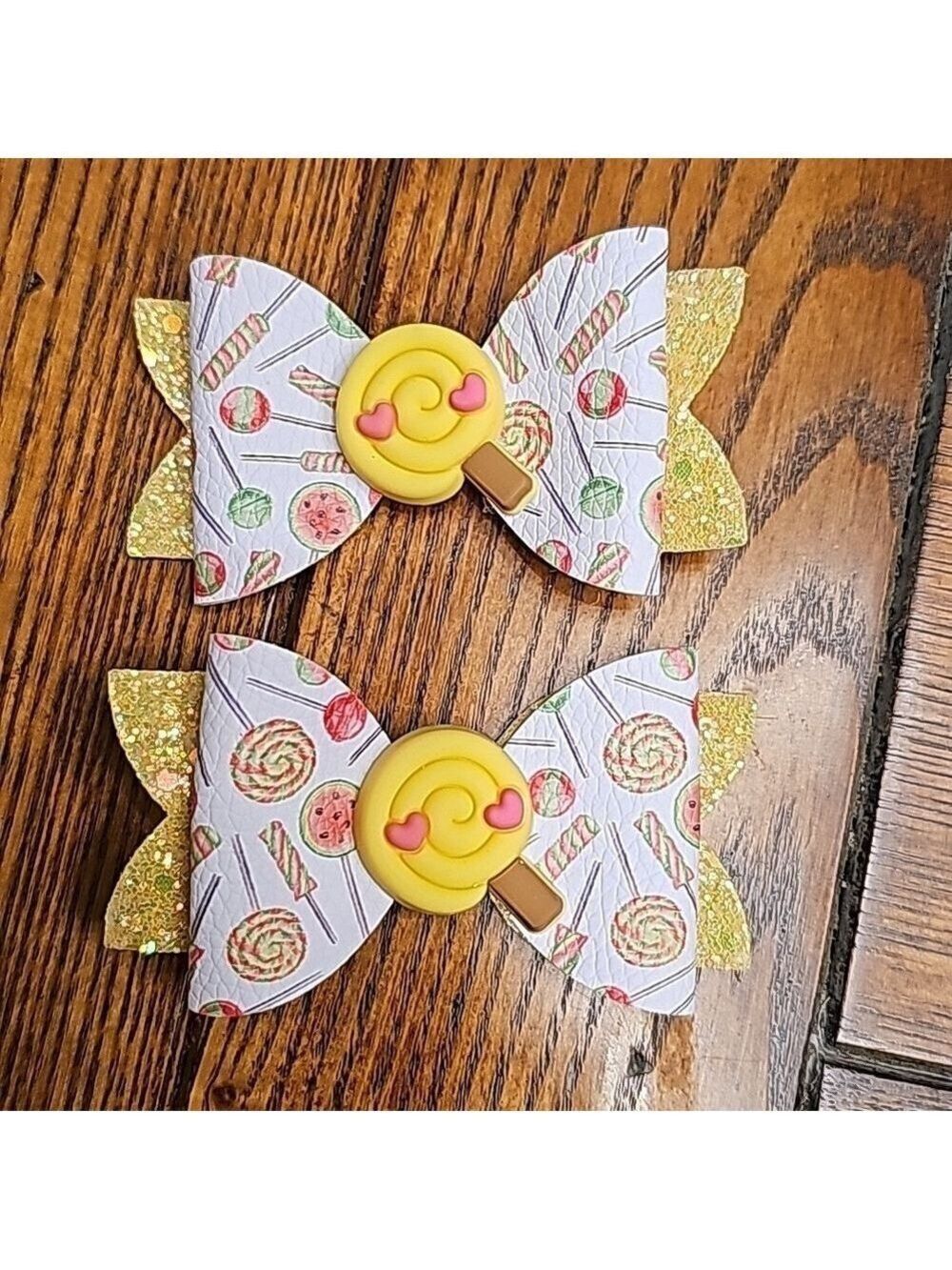 One pair of yellow lollipop hair bows